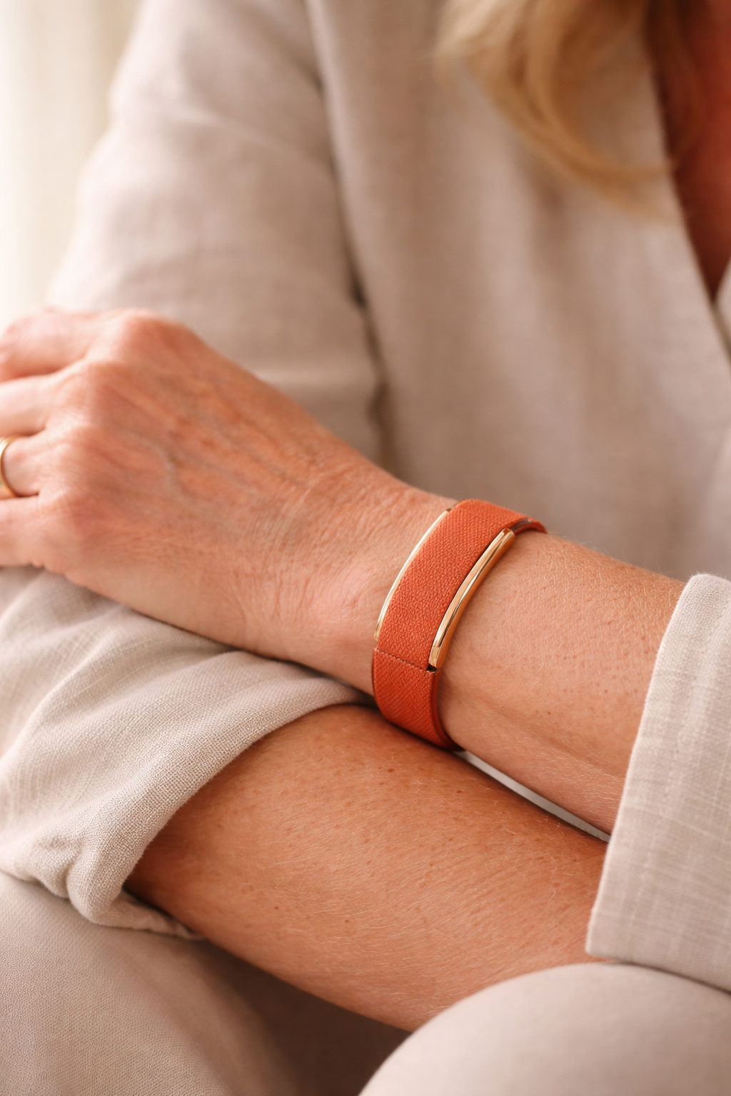 Woman wearing Nura Rose Gold bracelet